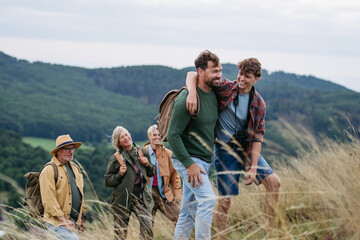 Multigenerational family on hiking trip in nature.