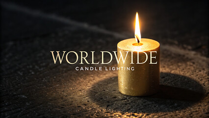 A solitary golden candle burns brightly in the darkness casting a warm glow and illuminating the word worldwide in elegant white lettering