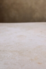 beige table and brown wall background