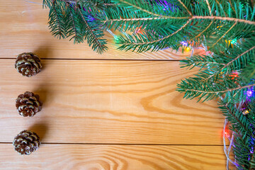 Spruce branches, golden balls and cones create a decorative winter model