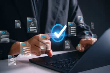 Professional e-filing tax documents with check mark approval through virtual interface, business user completing financial forms and managing income reports using digital platform