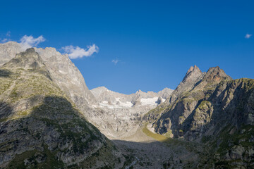 This landscape photo was taken in Europe, Italy, Aosta Valley, in summer. It shows the glacier and...