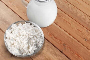 Glass of milk and dairy products on desk