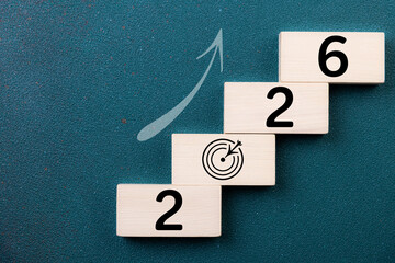 2026 New Year card. New Years goals 2026 with wooden cube, target icon. Concept 2026 New Year background. Goal, plan, action, business, resolutions,  financial, success, ideas