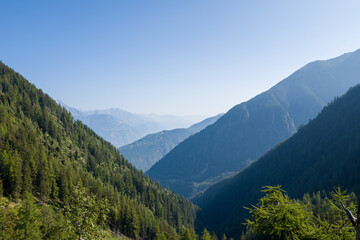 This landscape photo was taken in Europe, France, Auvergne Rhone Alpes, Haute Savoie, in summer. We can see the mountains, under the Sun.