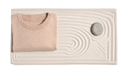 Cozy sweater on zen sand garden, calm and peaceful mood