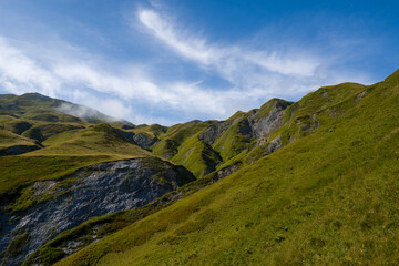 This landscape photo was taken in Europe, France, Auvergne Rhone Alpes, Haute Savoie, in summer. We can see the mountains, under the Sun.