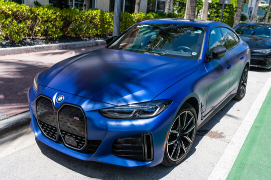 Miami, Florida, USA - April 13, 2025: BMW i4 M50 2023 electric car. Luxury electric car BMW M50. Car BMW i4 model M50 electric parked outdoor. Blue electric car, side view