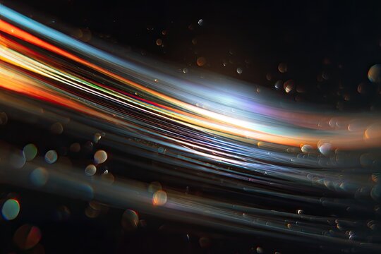 Abstract composition of swirling, streaking light patterns with bokeh effect, on a dark background