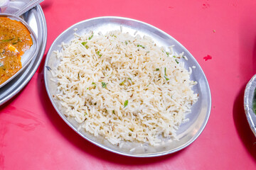 This landscape photo was taken in Asia, India, Delhi, Delhi, in summer. It shows the Indian meal Paneer Butter Masala in Delhi, under the Sun.