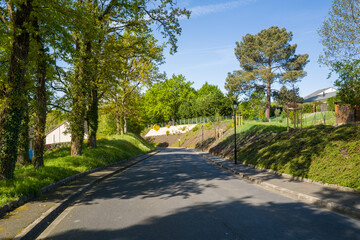 This landscape photo was taken in Europe, France, Centre Val de Loire, Loiret, Dampierre en Burly, in summer. We can see the street in Dampierre en Burly, under the Sun.
