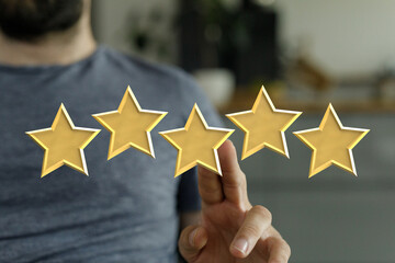 A person's hand interacting with golden stars symbolizing positive feedback, satisfaction, and...