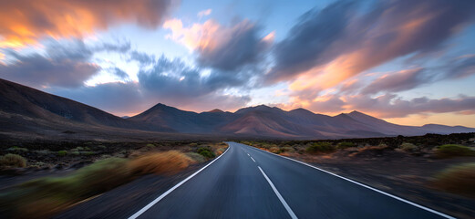 The Golden hour in summer.to unexplored road journeys and adventures. Road through the scenic Sunset landscape to the destination in  natural park Amazing panorama.