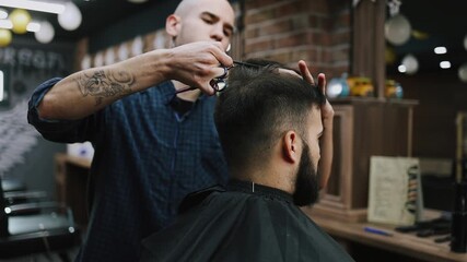 Hairdresser cutting a male client's dark hair with scissors and comb in a modern barbershop, close-up on hands and head highlighting precision, style and professional grooming