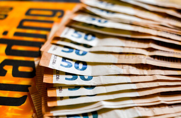 macro detail of a bunch of 50 euros banknotes