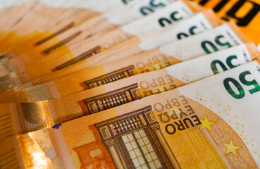 macro detail of a bunch of 50 euros banknotes