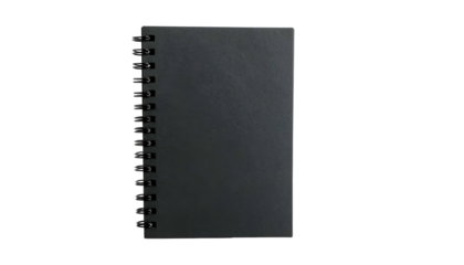 A black rectangular notepad with a spiral binding on a solid black background, top-down view