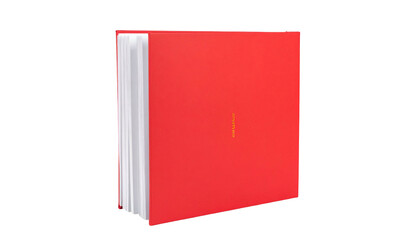 A hardcover book with red cover, white pages, and subtle orange text against a black background