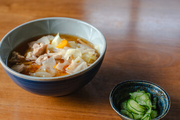 Japanese breakfast with pork soup and cucumber salad