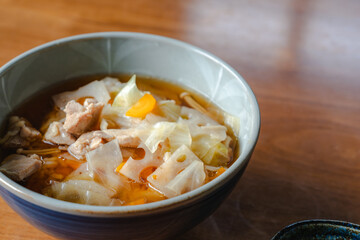 Japanese breakfast with pork soup and cucumber salad