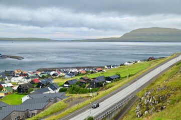 Aerial View of Moody Torshavn City and North Atlantic Coastline in Faroe Islands
