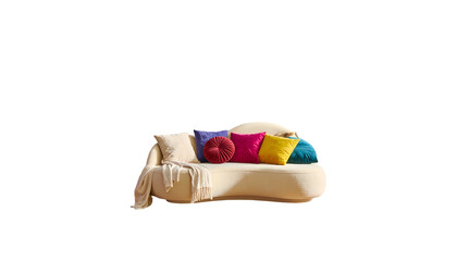 Curvy, cream sofa with colorful pillows, blanket, bathed in sunlight, against a stark black background