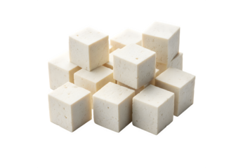 Pieces of chopped white tofu on a white surface
