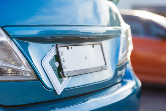 P plate shoved under numberplate on back of car