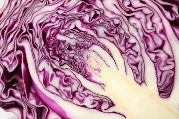 Obraz premium Cut red cabbage as background, closeup view