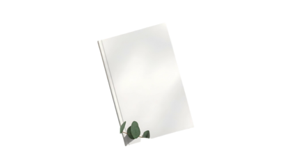 A plain, closed book with white cover, casting shadow; tiny greenery detail on dark backdrop
