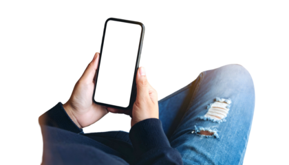 Person holding a mobile phone with blank screen, knees crossed, isolated on black