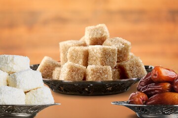 Ramadan concept, sugar in muslim bronze plate