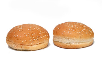 Golden bakery hamburger bread buns on white.