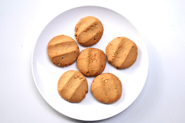 Delicious Cookies Served on White Plate for Snack Time.