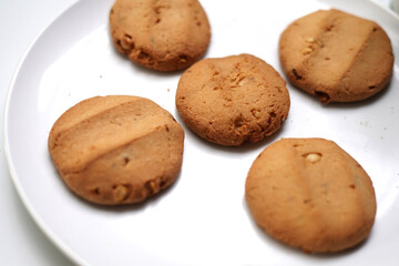 Crunchy Biscuits on White Dish Close-Up.