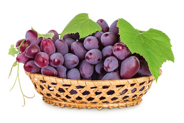 Red grape berry bunch in a wicker basket isolated on white background