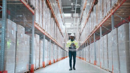 Male worker wearing reflective jacket and white helmet checking inventory with tablet in modern warehouse. Engineer surrounded by tall shelves and digital holographic interface. Logistics center. - Powered by Adobe