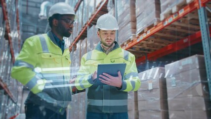 Two industrial workers in helmets and reflective jackets checking stock in warehouse. One holding tablet displaying digital projection while colleague pointing at shelves with packed goods. - Powered by Adobe