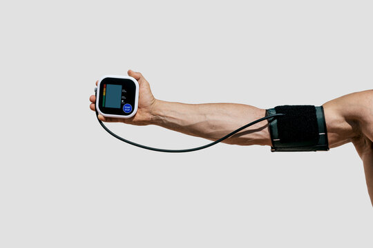 Blood pressure monitor in use with arm extended