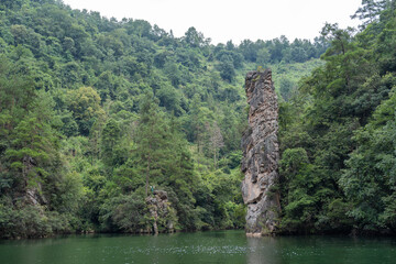 Rock and vegetation on Baofeng lake or Baofeng Hu is artificial fresh water lake in Wulingyuan Scenic Area, Suoxiyu village, wulingyuan district, Zhangjiajie city, Hunan, China