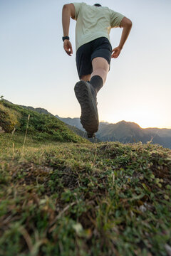 Trail running adventure in the Pyrenees at sunrise