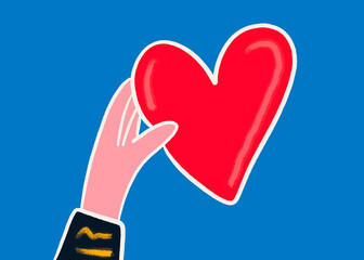 Hand holding heart symbolizing love and kindness