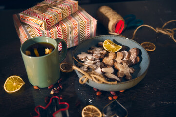 Cozy Holiday Tea, Dusted Cookies, and Gift Wrapping Scene With Citrus Slices