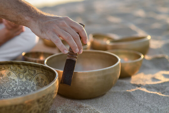 Meditation with Tibetan Bowls on Tranquil Beach