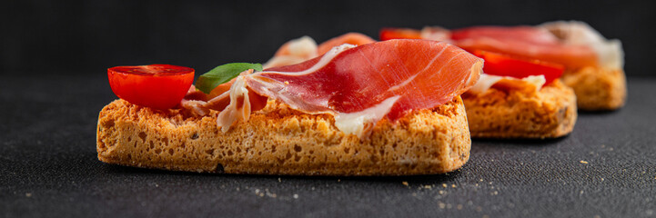 jamon bruschetta prosciutto appetizer portioned tapas dish natural tasty snack fresh delicious gourmet food background on the table rustic top view copy space