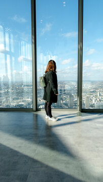 Woman admiring London's skyline from Horizon 22 viewpoint