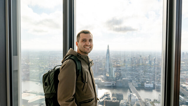 Happy man enjoying views from Horizon 22 in London