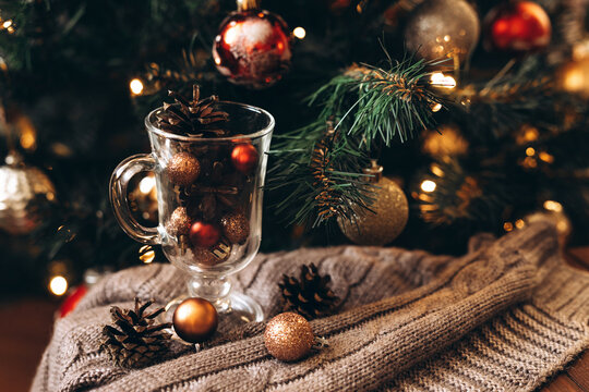Cozy christmas decor with baubles and pinecones