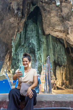 Woman taking selfie at Batu Caves in Kuala Lumpur
