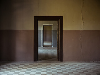 Perspective view through abandoned interior doorways